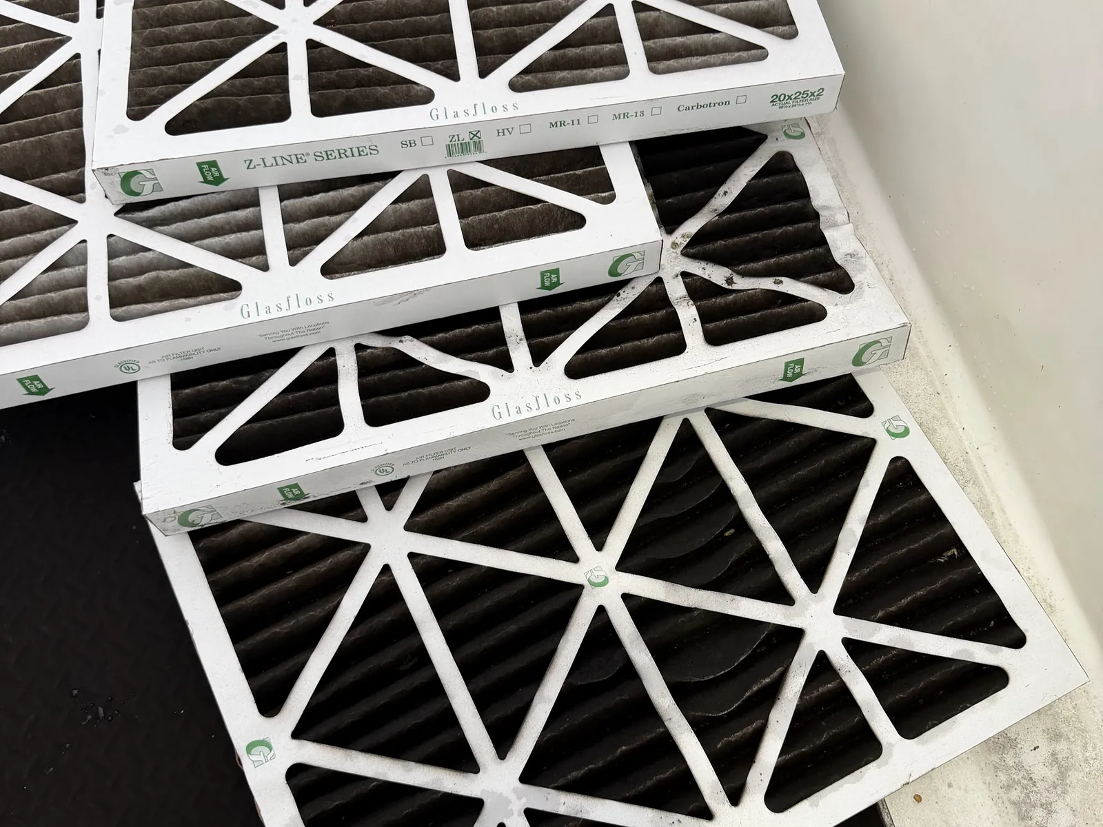 Replacement air filters laid out during a maintenance visit