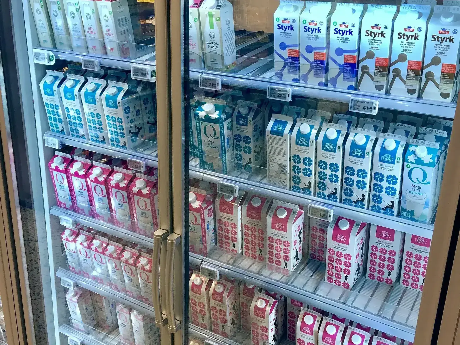 Glass-door refrigerated display cases in a grocery store