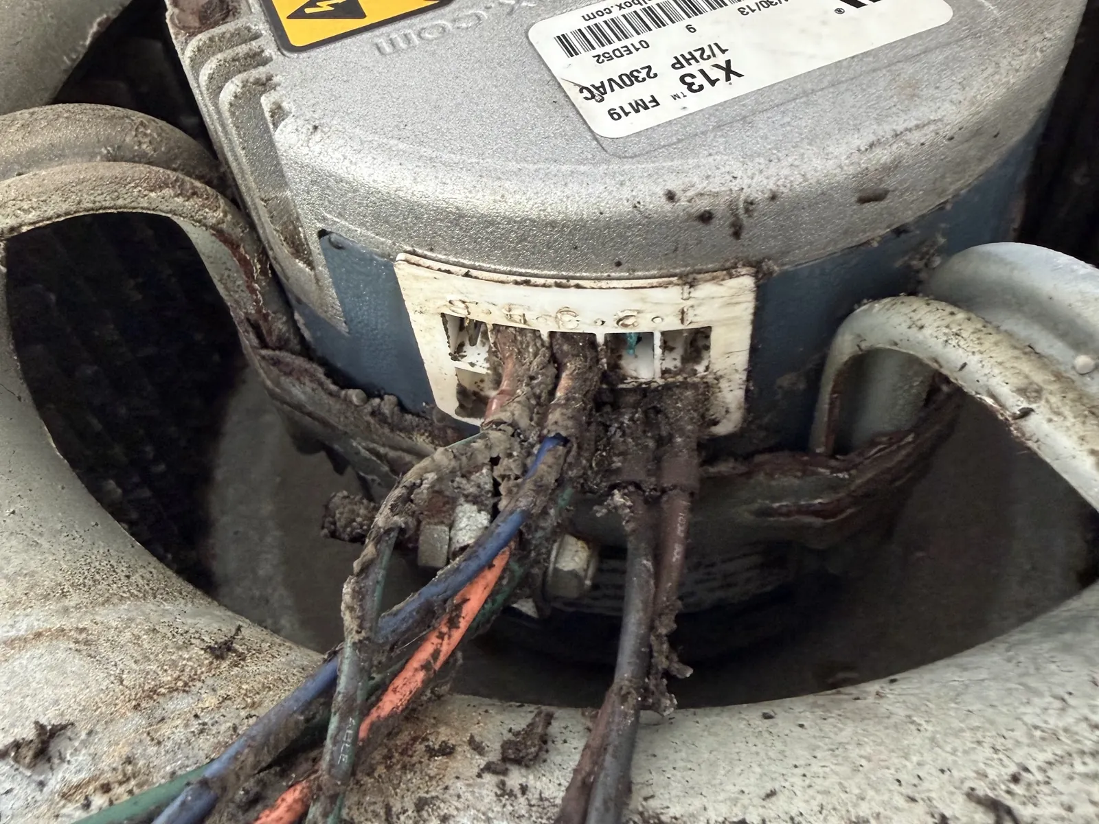 Dirty condenser fan motor and corroded wiring found during a service call