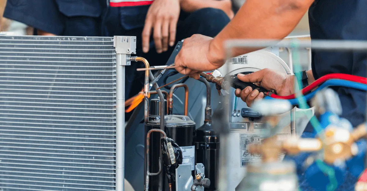 Doctor Fridge technician brazing a refrigerant line