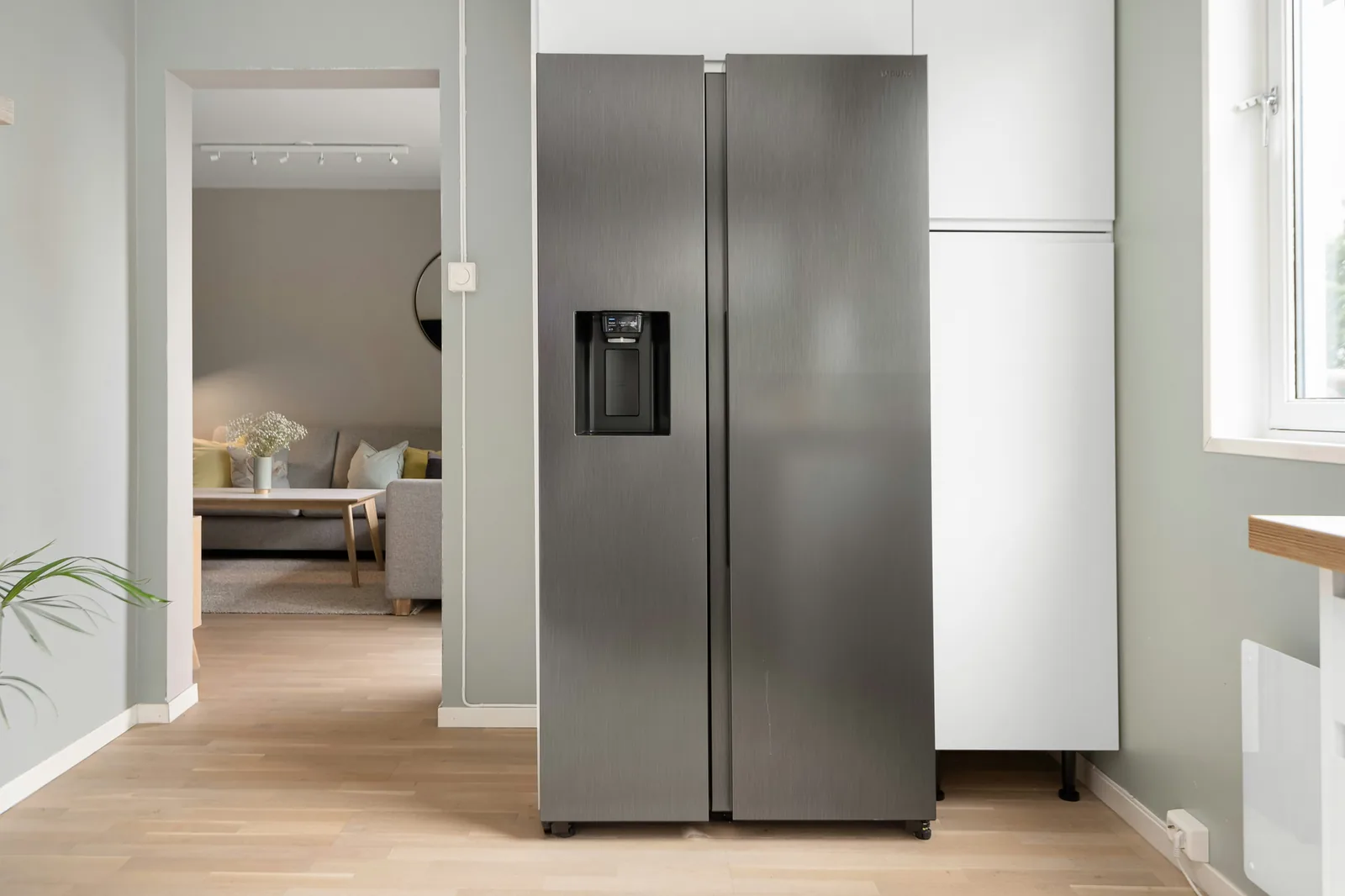 Stainless steel refrigerator in a home kitchen