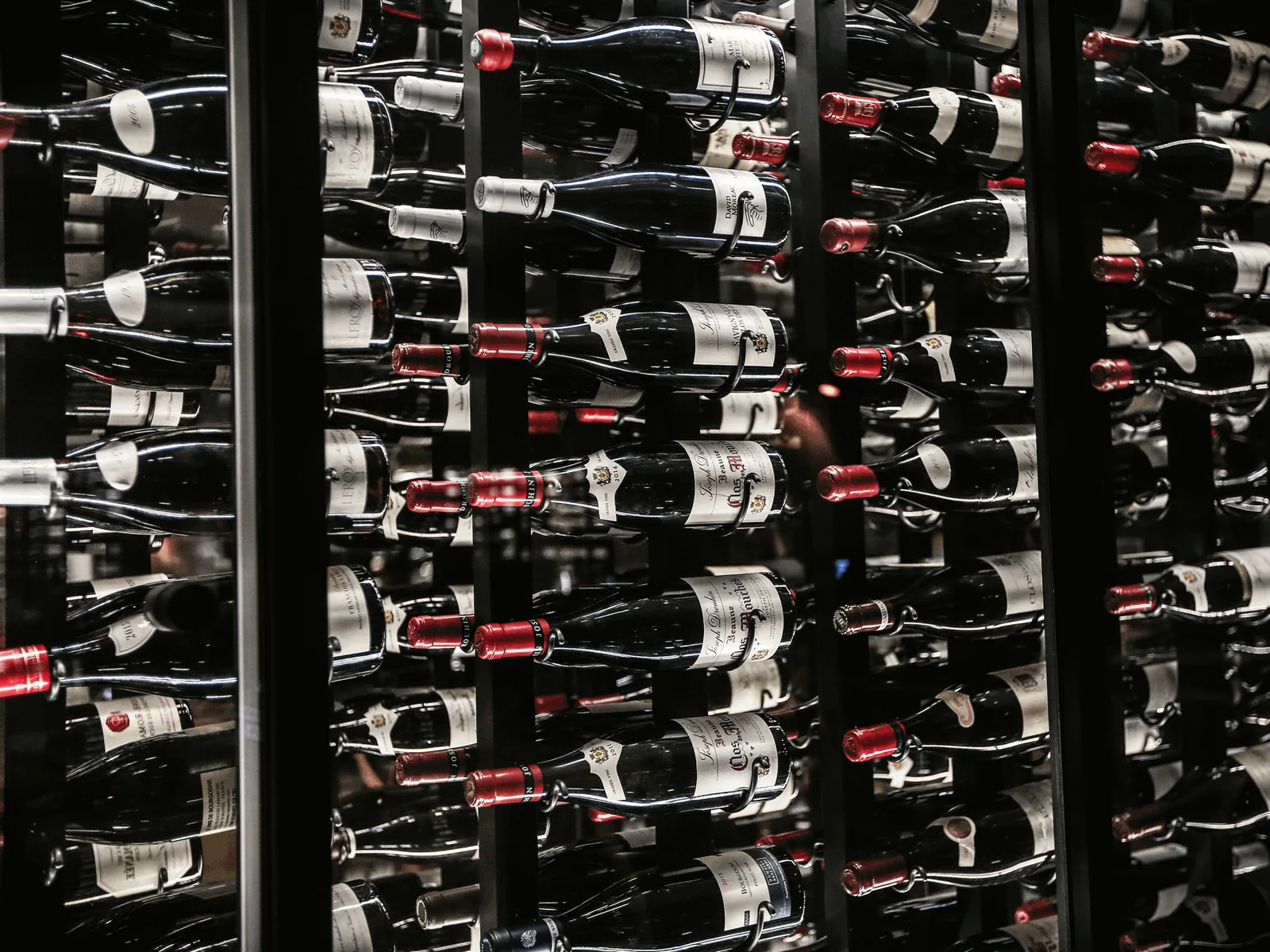 Temperature-controlled wine cellar racking filled with bottles
